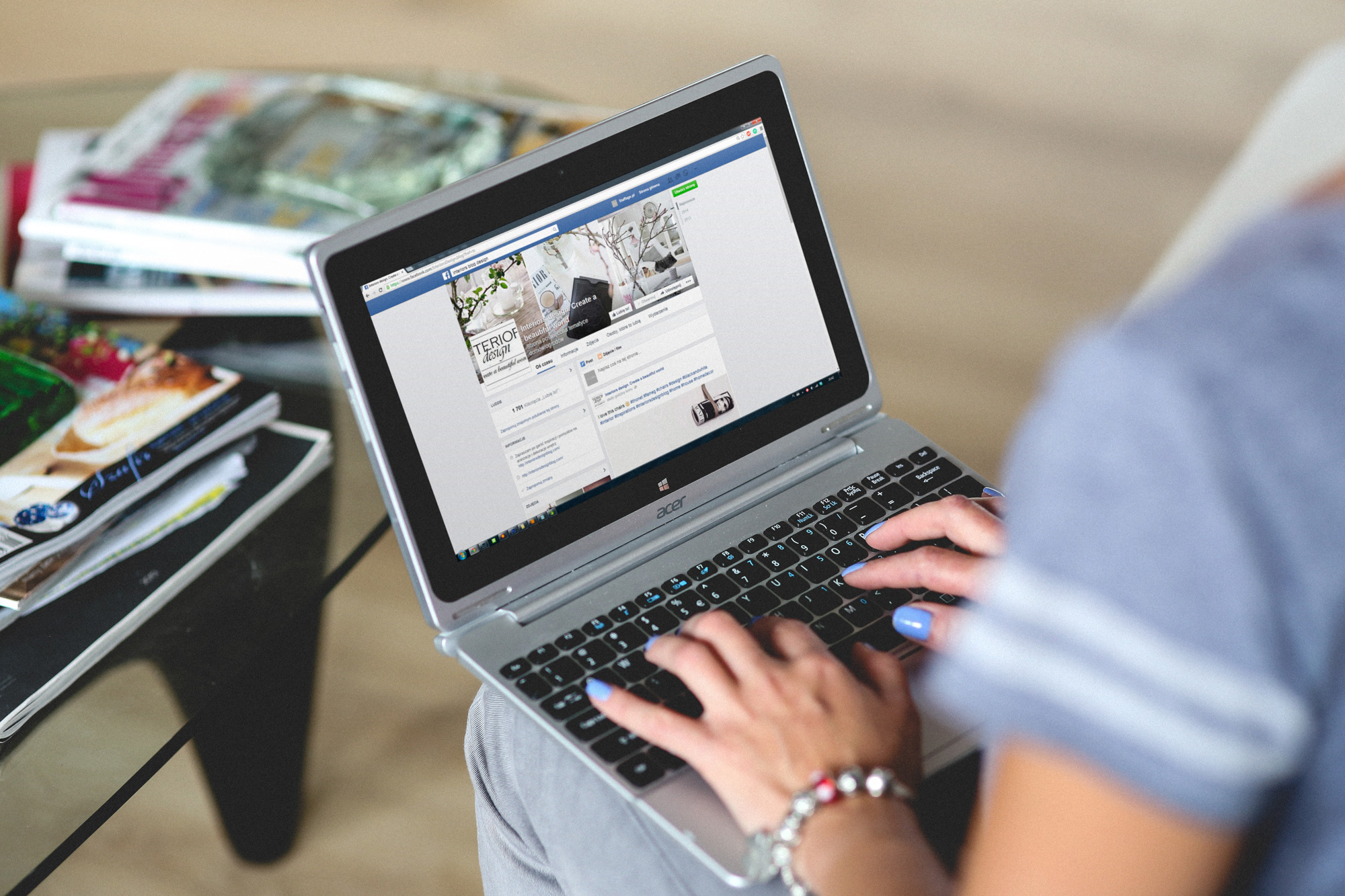 Person on laptop using Facebook