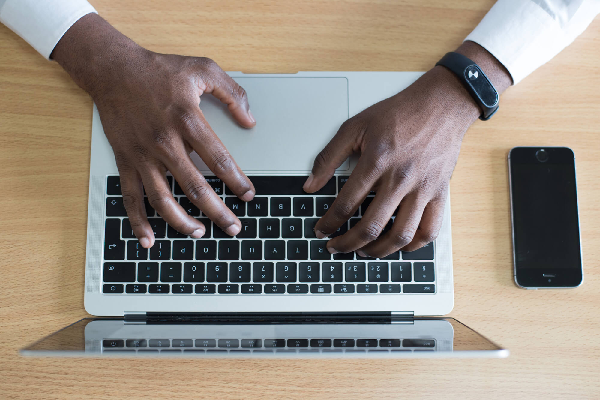 hands on a laptop keyboard