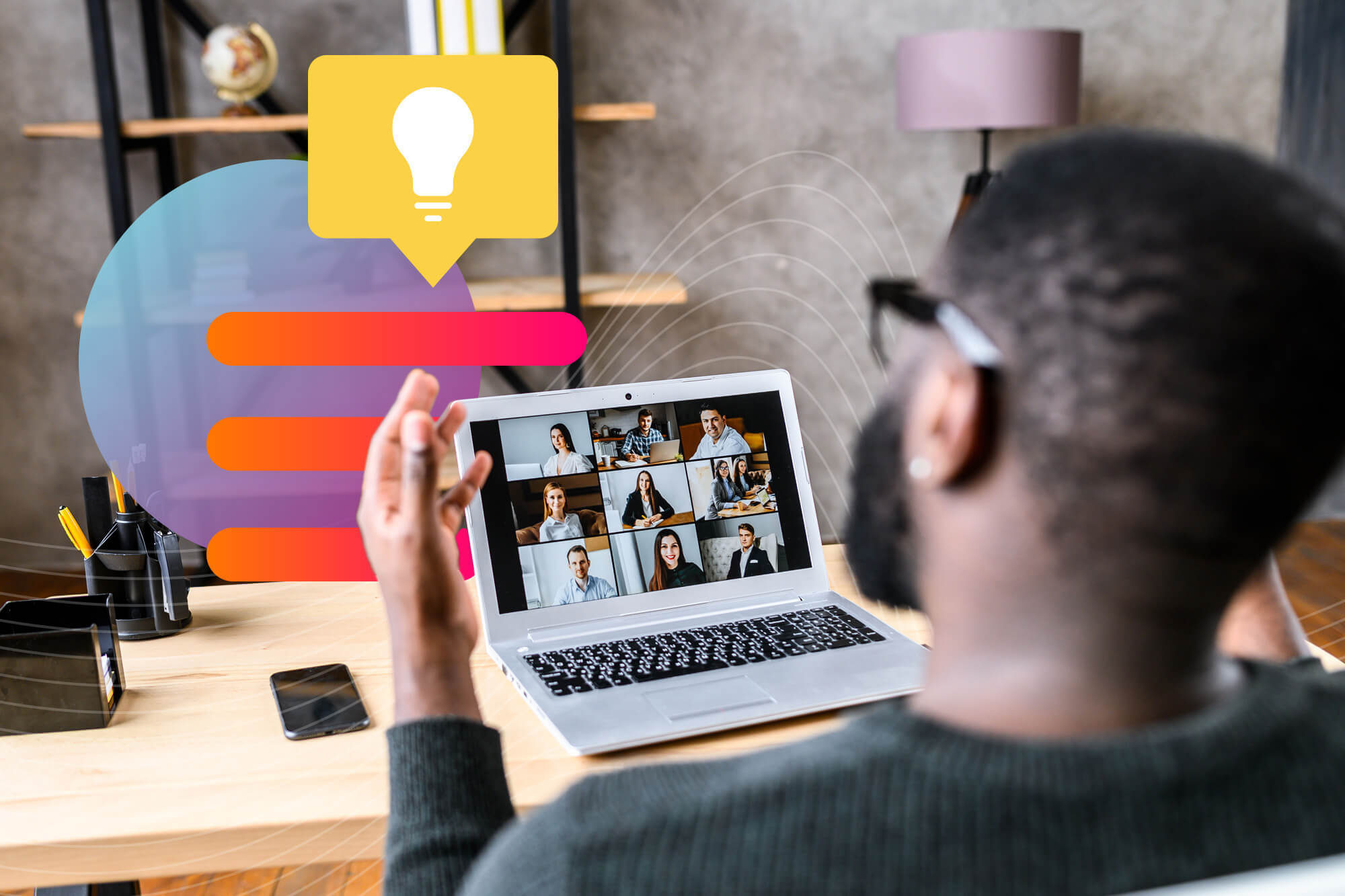 man video conferences with a team of people on his laptop