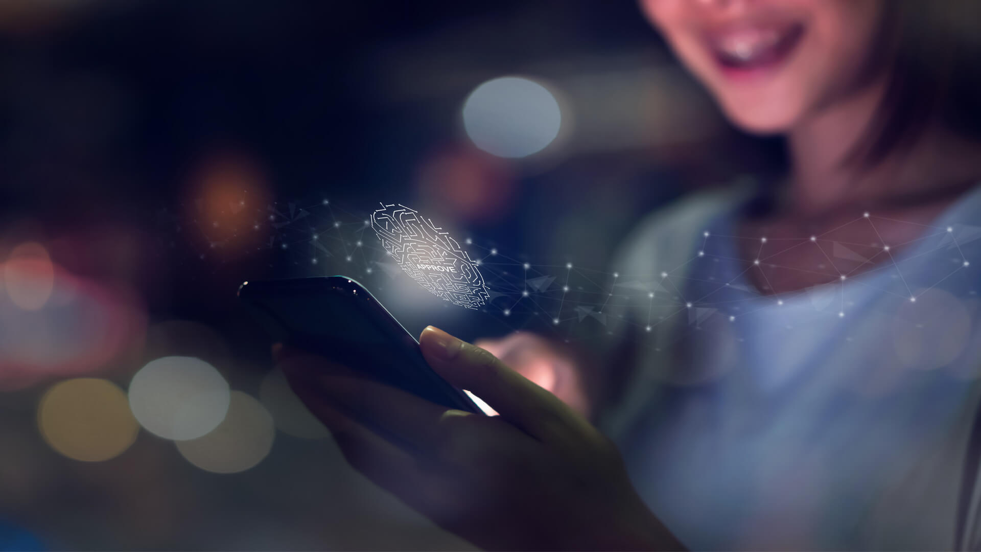 A woman types on a smartphone