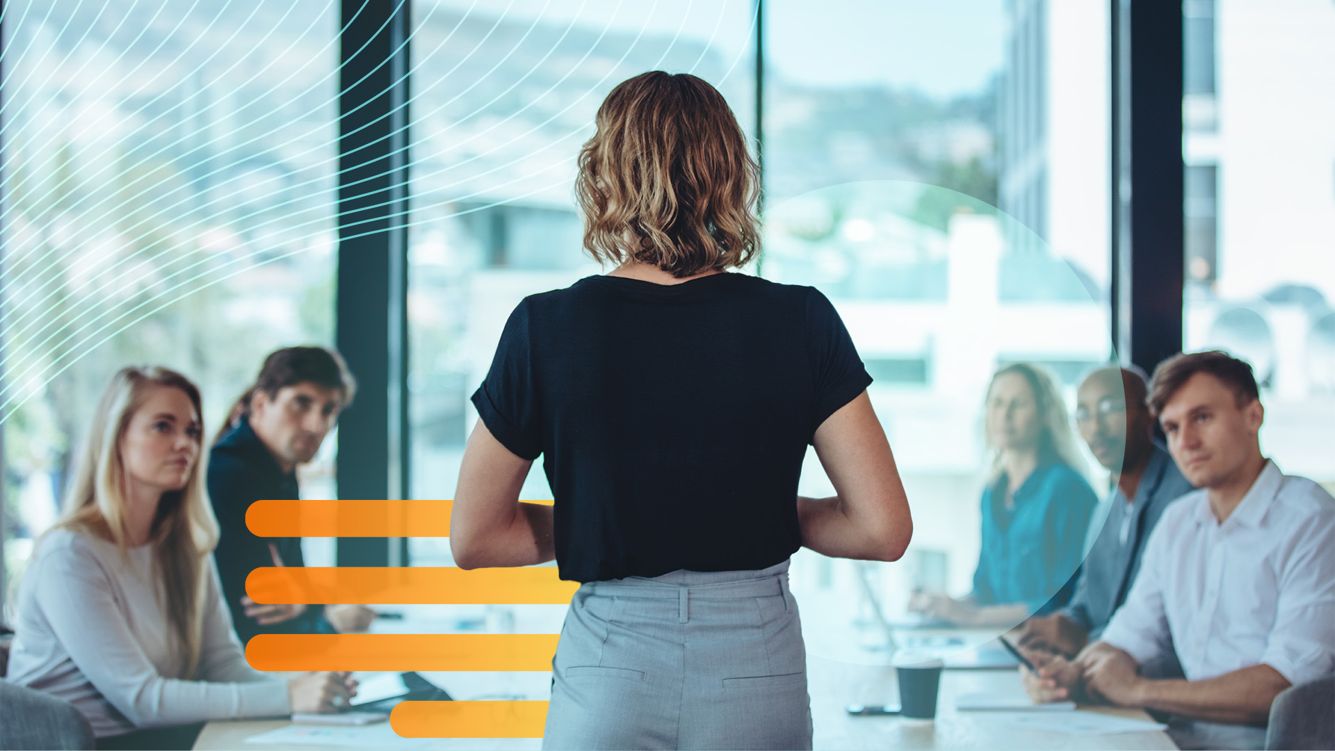 A woman presents in a boardroom