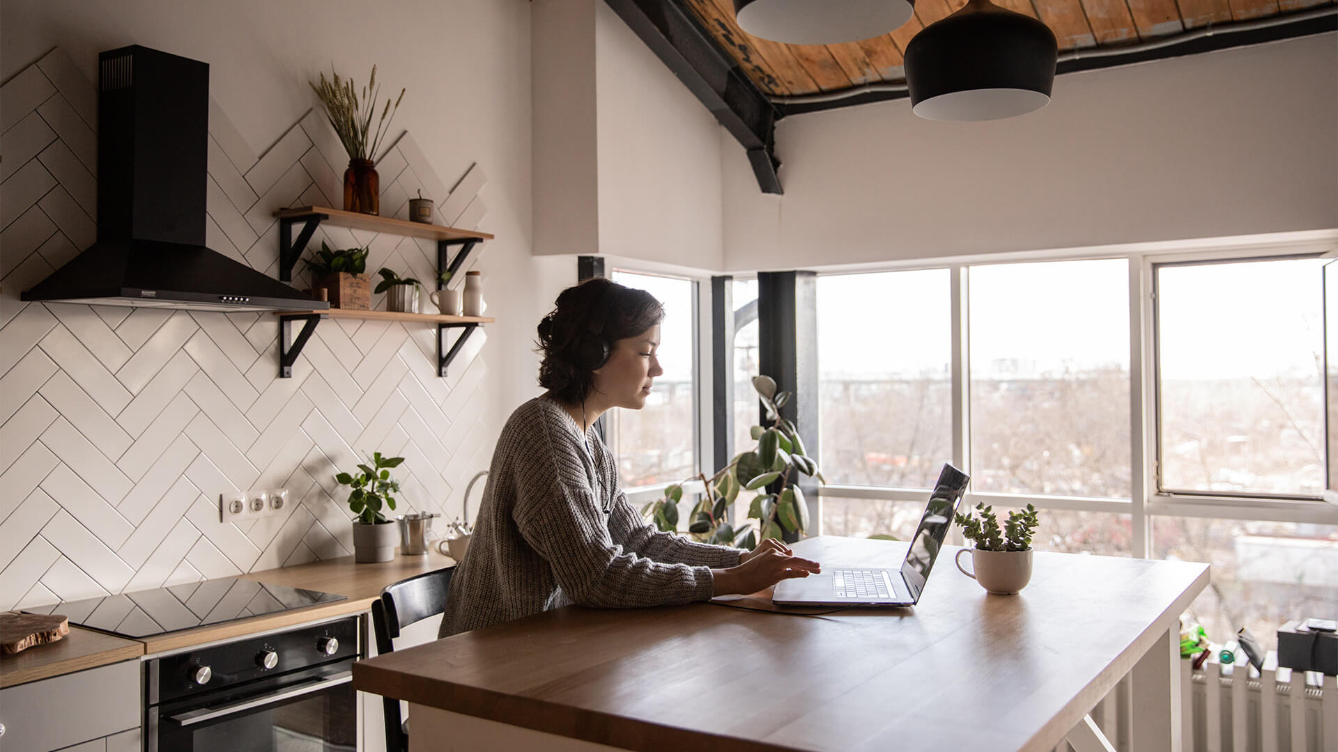 Woman typing on a laptop